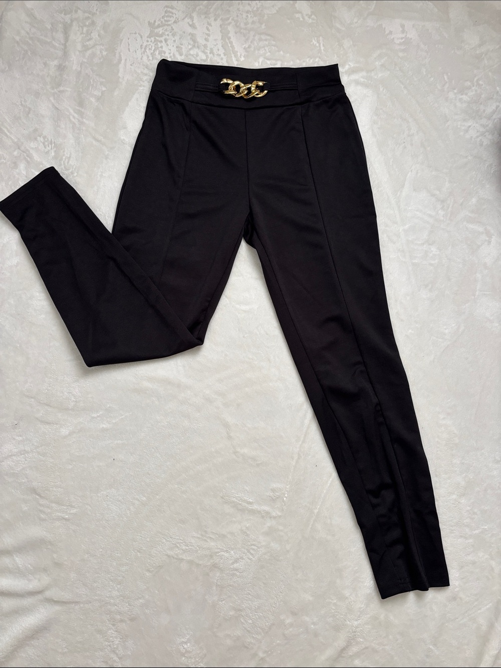 Black pants with gold hardware